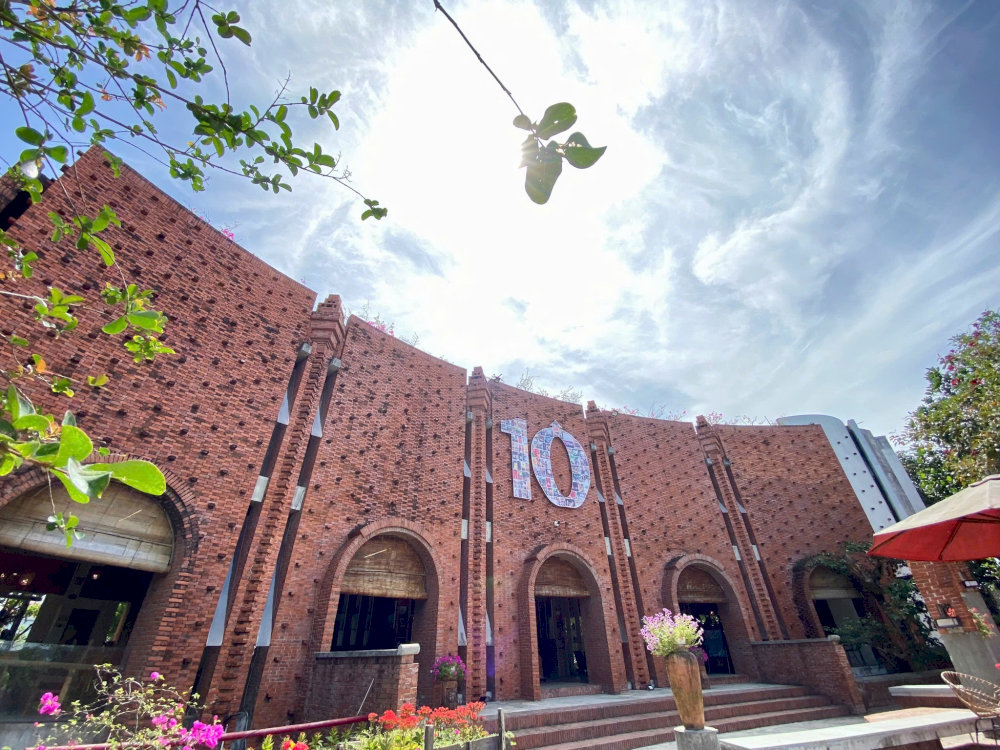 The domed roofs, ceramic paths, and brick courtyards reflect the village spirit and unique artistry
